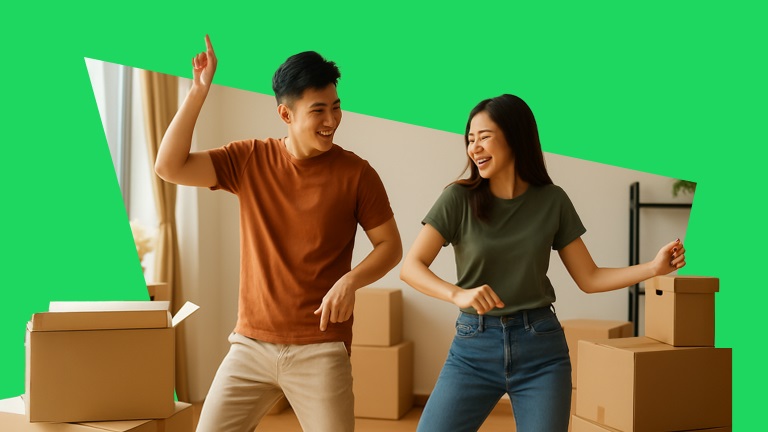 A couple dancing together in a living room